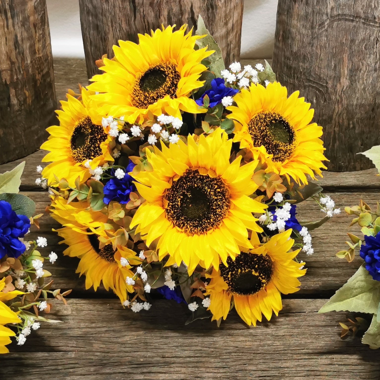 Sunflower bouquet with blue accents 