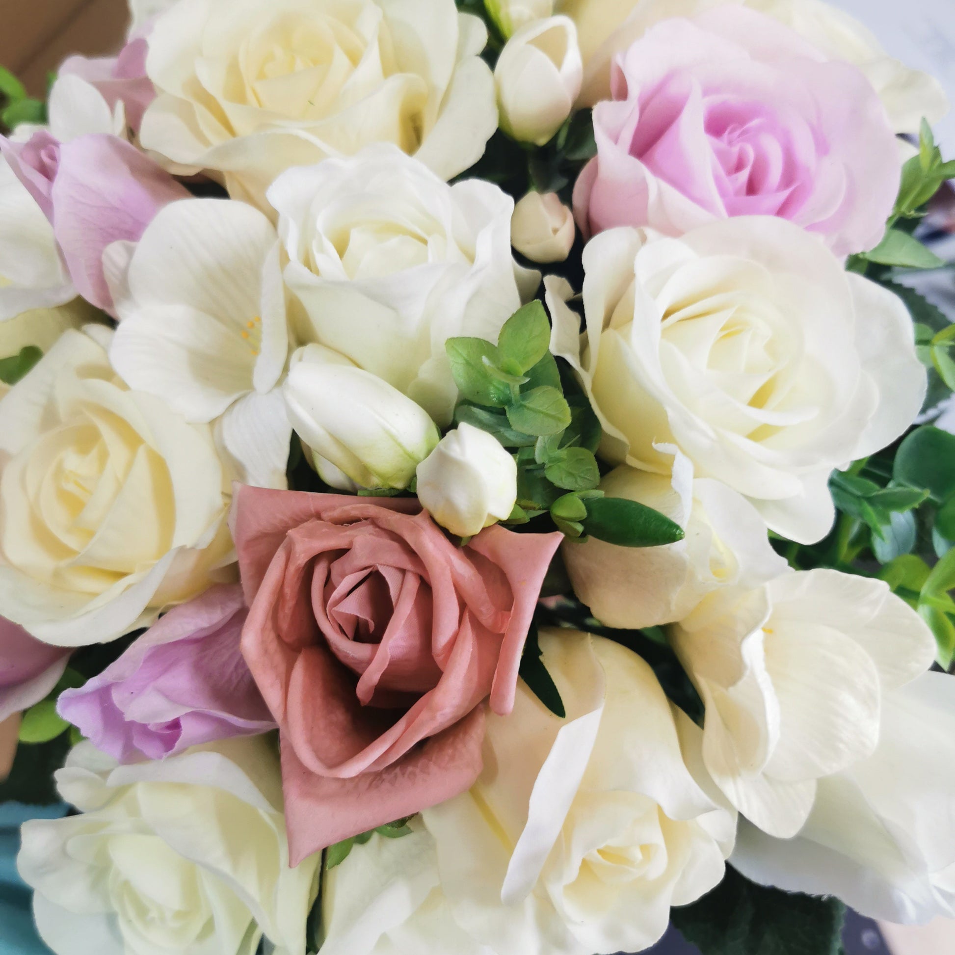 Bouquet of white and pink roses and freesia flowers 
