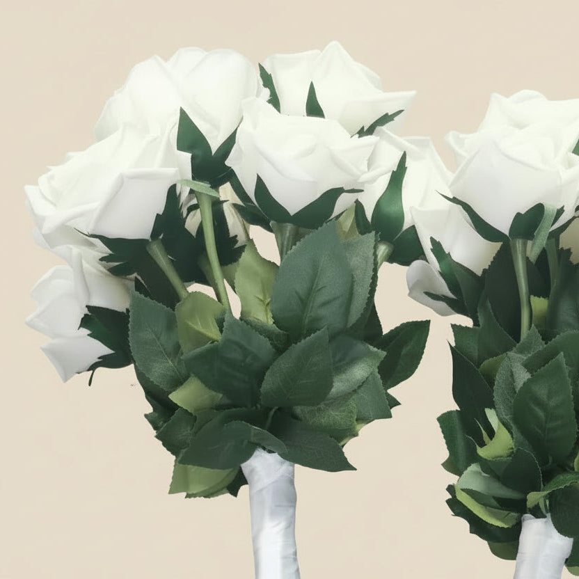 Two bouquets of white flowers with green stems 