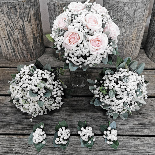 Bouquets of light pink roses with babies breath and boutonnieres 